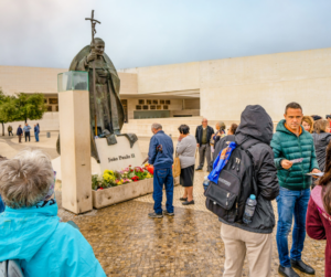 A Pilgrimage to Fatima Lourdes and Spain by St John Paul Statue | Hensley Travel